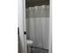 Bathroom featuring a toilet and shower behind a shower curtain at 4206 Revere Cir, New Port Richey, FL 34653