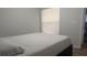 Neutral bedroom showcases a queen bed with a single window and light walls at 4206 Revere Cir, New Port Richey, FL 34653
