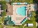 Aerial view of community pool, playground, and amenities at 4510 Beaumaris Dr, Land O Lakes, FL 34638