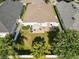 Aerial view of the backyard featuring a well-maintained lawn, patio with furniture, and privacy fence at 4510 Beaumaris Dr, Land O Lakes, FL 34638