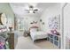 Charming bedroom adorned with soft colors, a ceiling fan, and decorative accents, creating a cozy retreat at 4510 Beaumaris Dr, Land O Lakes, FL 34638