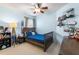 Charming bedroom with a ceiling fan, ample natural light, and playful décor, ideal for children at 4510 Beaumaris Dr, Land O Lakes, FL 34638