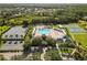 Aerial view of community amenities with a pool, clubhouse, basketball courts, playground, and tennis courts at 4510 Beaumaris Dr, Land O Lakes, FL 34638