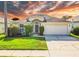 Charming single-Gathering home with a well-manicured lawn and a two-car garage at 4510 Beaumaris Dr, Land O Lakes, FL 34638