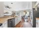 Modern kitchen and dining area with stainless steel appliances, bright and open at 4510 Beaumaris Dr, Land O Lakes, FL 34638