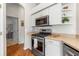 Modern kitchen with stainless steel appliances and sleek white cabinetry at 4510 Beaumaris Dr, Land O Lakes, FL 34638