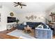 Inviting living room with a large sectional sofa, wooden accents and decor at 4510 Beaumaris Dr, Land O Lakes, FL 34638