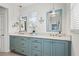 Stylish bathroom with custom cabinetry, double vanity, and modern fixtures at 511 Windward Psge, Clearwater Beach, FL 33767