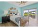 Bedroom with a king-sized bed, waterfront views, and sliding doors to a private balcony at 511 Windward Psge, Clearwater Beach, FL 33767
