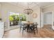 Cozy breakfast nook with modern lighting and views of the lush backyard at 511 Windward Psge, Clearwater Beach, FL 33767