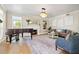 Living room featuring a piano, fireplace, and ample natural light at 511 Windward Psge, Clearwater Beach, FL 33767