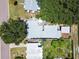 Aerial view of home and lot with a carport and metal arbor at 516 Northmoor N Ave, St Petersburg, FL 33702