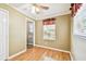 Comfortable bedroom with hardwood floors and a view into another room, enhanced by natural light at 516 Northmoor N Ave, St Petersburg, FL 33702