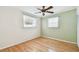 This bright bedroom features hardwood flooring and large windows letting in natural light at 516 Northmoor N Ave, St Petersburg, FL 33702