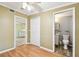 Bedroom with a view into the kitchen and bathroom, offering convenience and practicality at 516 Northmoor N Ave, St Petersburg, FL 33702