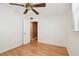 Spacious bedroom featuring hardwood flooring, an open door to the hallway, and one window at 516 Northmoor N Ave, St Petersburg, FL 33702