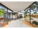 View of the house from the carport showcasing an outdoor seating area and ramp at 516 Northmoor N Ave, St Petersburg, FL 33702