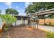 Exterior home with a carport, metal arbor and landscaping at 516 Northmoor N Ave, St Petersburg, FL 33702