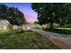 Charming single-story home with a well-maintained lawn and mature trees providing ample shade at 516 Northmoor N Ave, St Petersburg, FL 33702