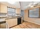 Well lit kitchen with stainless steel appliances, laminate countertops, and a stainless steel sink at 516 Northmoor N Ave, St Petersburg, FL 33702