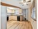 Modern kitchen equipped with sleek cabinetry, updated appliances, and durable laminate wood flooring at 516 Northmoor N Ave, St Petersburg, FL 33702