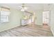 Light and airy living room features modern laminated floors, and a door to the backyard at 516 Northmoor N Ave, St Petersburg, FL 33702