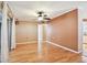 Bright living space with hardwood floors, ceiling fan, and sliding doors leading to an outdoor area at 516 Northmoor N Ave, St Petersburg, FL 33702