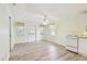 Spacious living room with light walls, lots of natural light, laminated floors, and recessed lighting at 516 Northmoor N Ave, St Petersburg, FL 33702