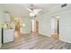Spacious living room features laminated floors, neutral paint, and multiple entryways for convenience at 516 Northmoor N Ave, St Petersburg, FL 33702