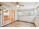 Sun room features linoleum flooring, multiple windows letting in natural light, and glass sliding doors at 516 Northmoor N Ave, St Petersburg, FL 33702