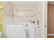 Easy access walk-in tub with safety features, set against a tiled wall in a well-lit bathroom at 516 Northmoor N Ave, St Petersburg, FL 33702