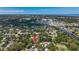 Wide aerial view of community with mature trees and waterway to the east at 5323 73Rd N St, St Petersburg, FL 33709