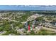 Aerial view shows property in established neighborhood near a commercial area and waterway at 5323 73Rd N St, St Petersburg, FL 33709