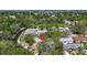 Stunning aerial view of lush neighborhood with mature trees and waterway behind homes at 5323 73Rd N St, St Petersburg, FL 33709