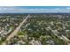 Scenic aerial view captures the property's proximity to roadway and a serene creek at 5323 73Rd N St, St Petersburg, FL 33709
