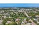 Wide aerial view shows location close to community, roadway, and the intercoastal waterway at 5323 73Rd N St, St Petersburg, FL 33709