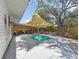 Backyard pool with covered patio and landscaping, perfect for outdoor relaxation and recreation at 5323 73Rd N St, St Petersburg, FL 33709