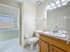 Clean bathroom with a tub and shower and a sink at 5323 73Rd N St, St Petersburg, FL 33709