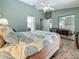 Cozy bedroom featuring a mirrored closet, tile floors and ensuite bath and view of other room at 5323 73Rd N St, St Petersburg, FL 33709