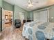 Comfortable bedroom with ceiling fan, sliding glass doors to the backyard and ensuite bath at 5323 73Rd N St, St Petersburg, FL 33709
