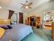 Comfortable bedroom with ceiling fan, TV cabinet, and outdoor access at 5323 73Rd N St, St Petersburg, FL 33709