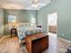 Bright bedroom with large windows, ceiling fan and ensuite bath featuring dual sinks at 5323 73Rd N St, St Petersburg, FL 33709