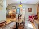 Dining room with a skylight, decorative lighting, and a view into the kitchen at 5323 73Rd N St, St Petersburg, FL 33709
