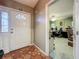 Entryway featuring tile floors leading to a doorway into an office space at 5323 73Rd N St, St Petersburg, FL 33709