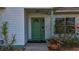 Close-up of a charming front door with decorative details and inviting curb appeal at 5323 73Rd N St, St Petersburg, FL 33709