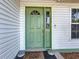 Inviting front door with a decorative window and a charming welcome mat, enhancing curb appeal at 5323 73Rd N St, St Petersburg, FL 33709