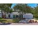 Charming single-story home with a well-manicured lawn and mature trees providing ample shade at 5323 73Rd N St, St Petersburg, FL 33709