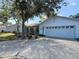 Home with a two-car garage and landscaping at 5323 73Rd N St, St Petersburg, FL 33709