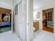 Hallway with doors leading to the bathroom and bedrooms at 5323 73Rd N St, St Petersburg, FL 33709