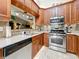 A view of the kitchen that features stainless steel appliances, stone countertops and recessed lighting at 5323 73Rd N St, St Petersburg, FL 33709